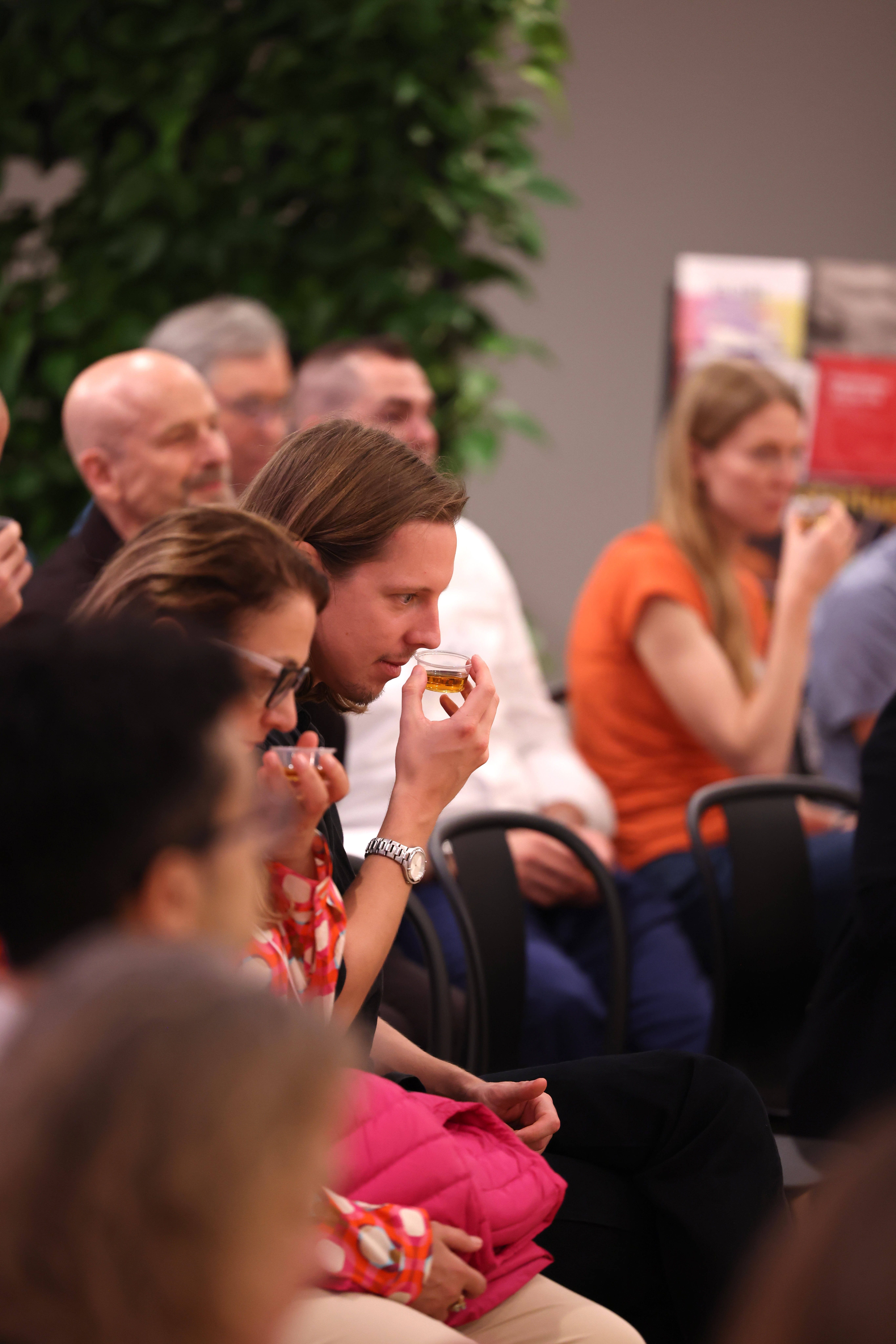 Participants examining and tasting workshop materials