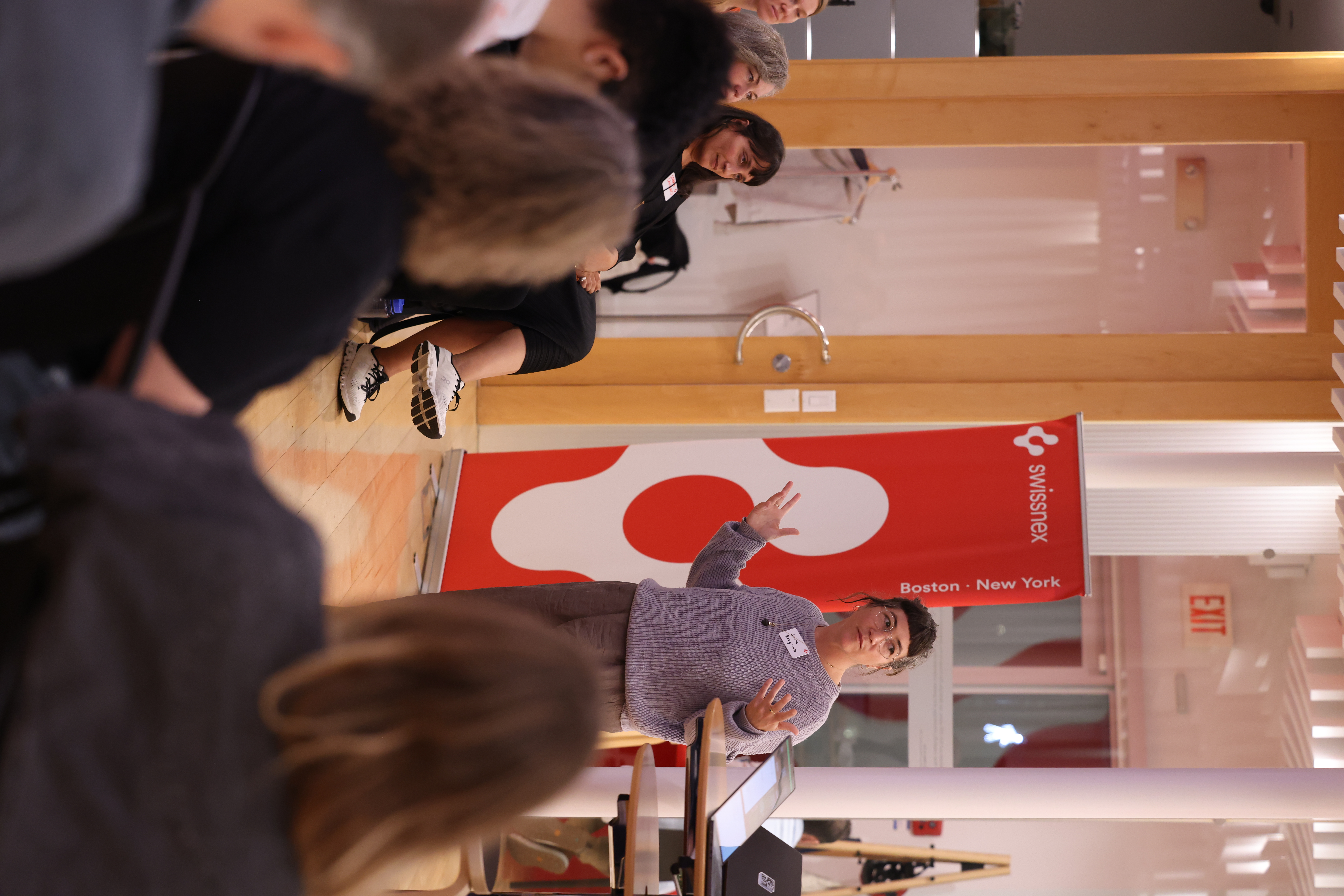 Sara Krugman speaking at the workshop with expressive hand gestures